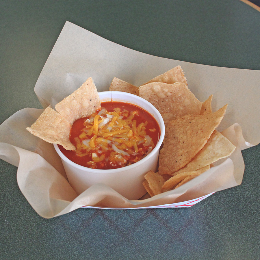 Burrito, tacos, chips and guacamole spread